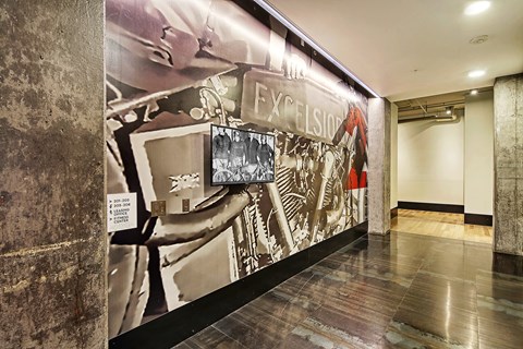 A hallway with a large mural on the wall.