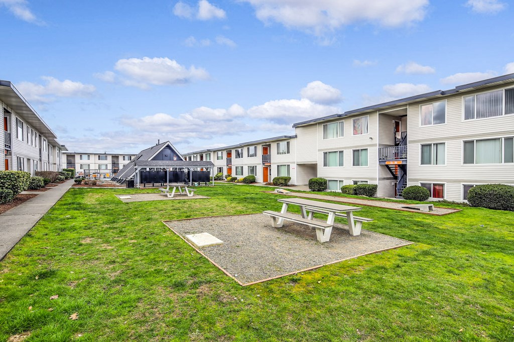 our apartments offer a spacious courtyard with picnic tables and fire pits