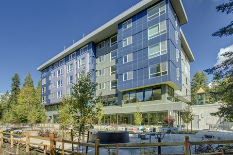an office building with a fountain in front of it