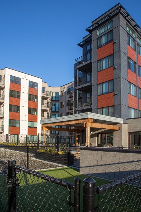a view of the front of a building with a fence