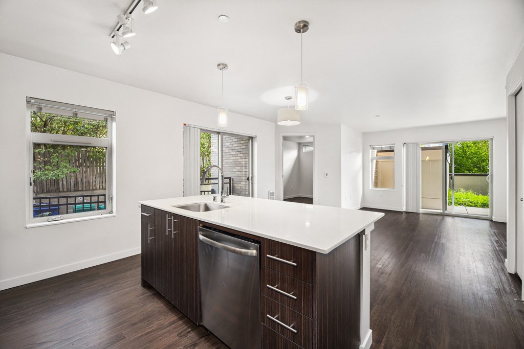 a kitchen with a large island and a large window