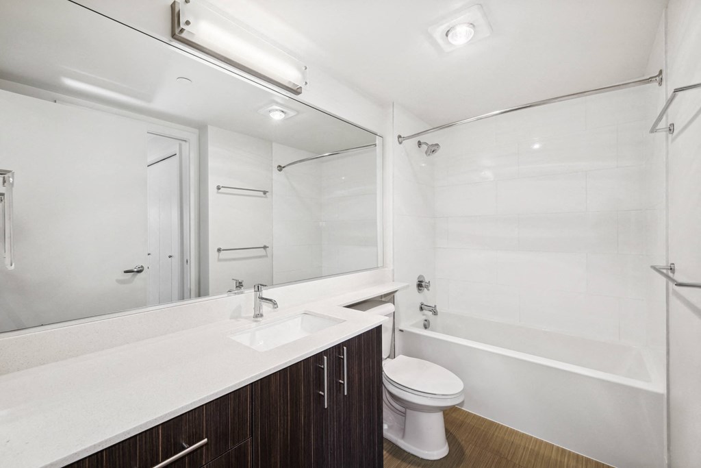 a bathroom with a sink toilet and a shower