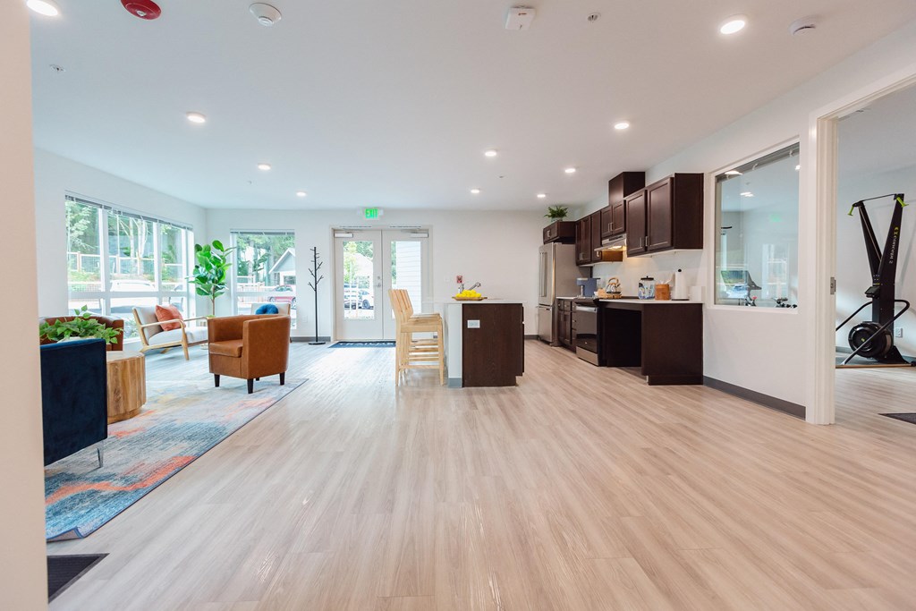 a living room with a kitchen and a dining room