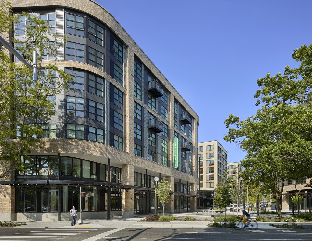 A modern building with a curved facade and large windows.