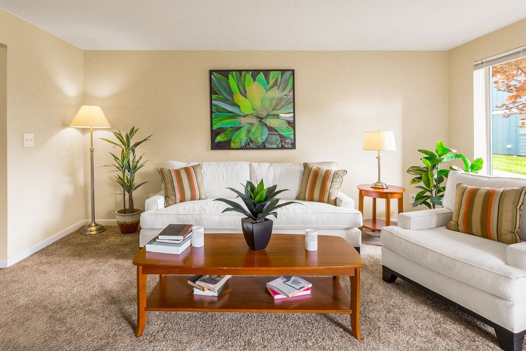 a living room with a white couch and a coffee table