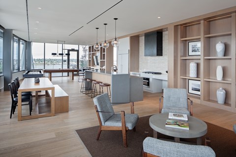 A modern living room with a dining table and chairs.