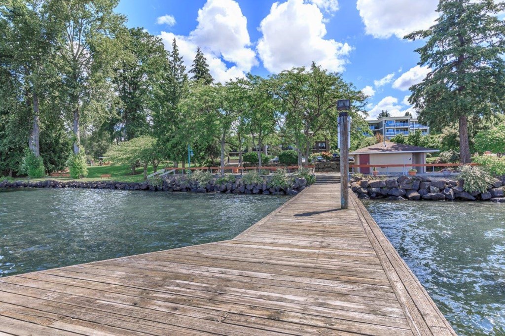 a dock over the water with a house on it