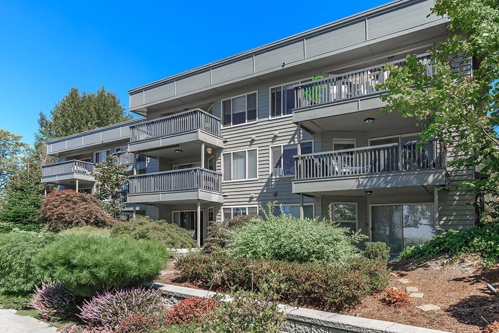 the exterior of an apartment building with balconies