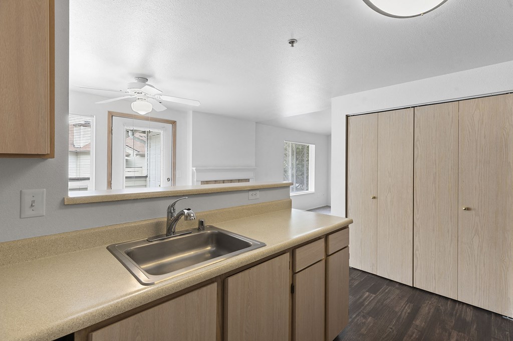 the kitchen of a home with a sink and cabinets