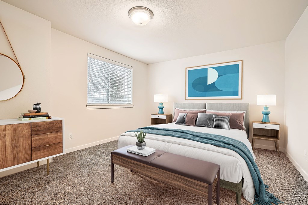 an open bedroom with a bed and a window