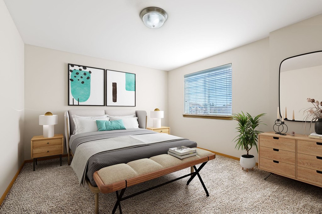 A bedroom with a bed, nightstands, a bench, and a plant.