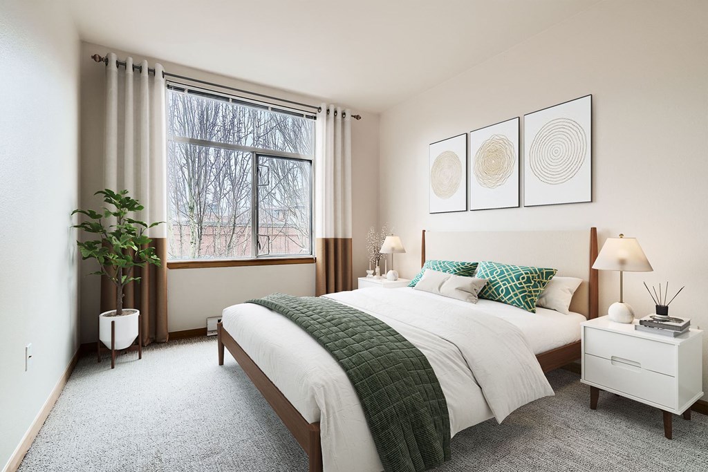 a bedroom with a bed and a window