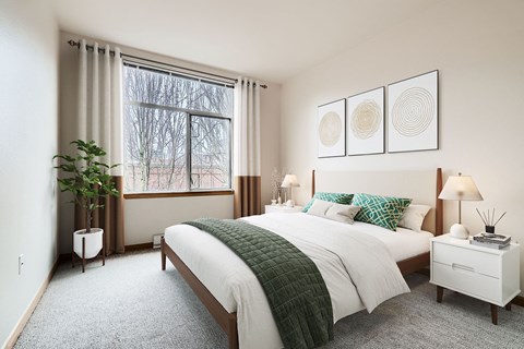 a bedroom with a bed and a window