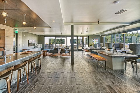 A modern open space with a long table and chairs.