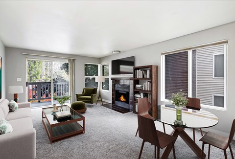 a living room with a fireplace and a table