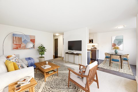 a living room with a couch and a table and a television