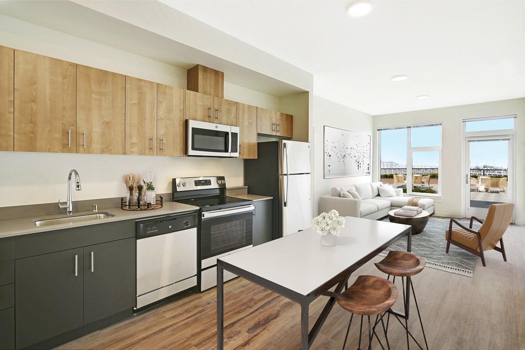 a kitchen and living room in an apartment