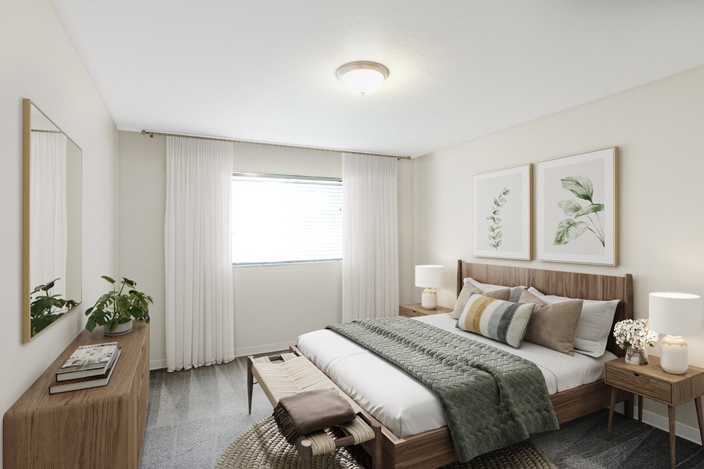 a bedroom with a bed and a desk and a window