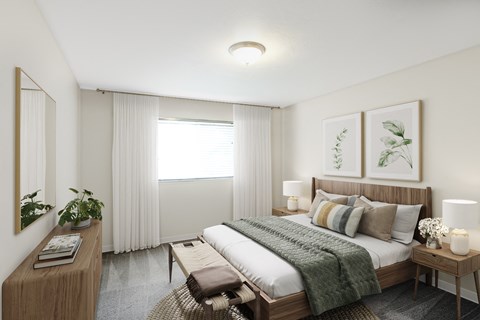 a bedroom with a bed and a desk and a window