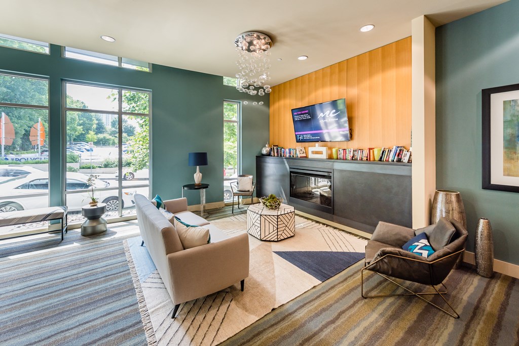 a living room with a fireplace and a large window