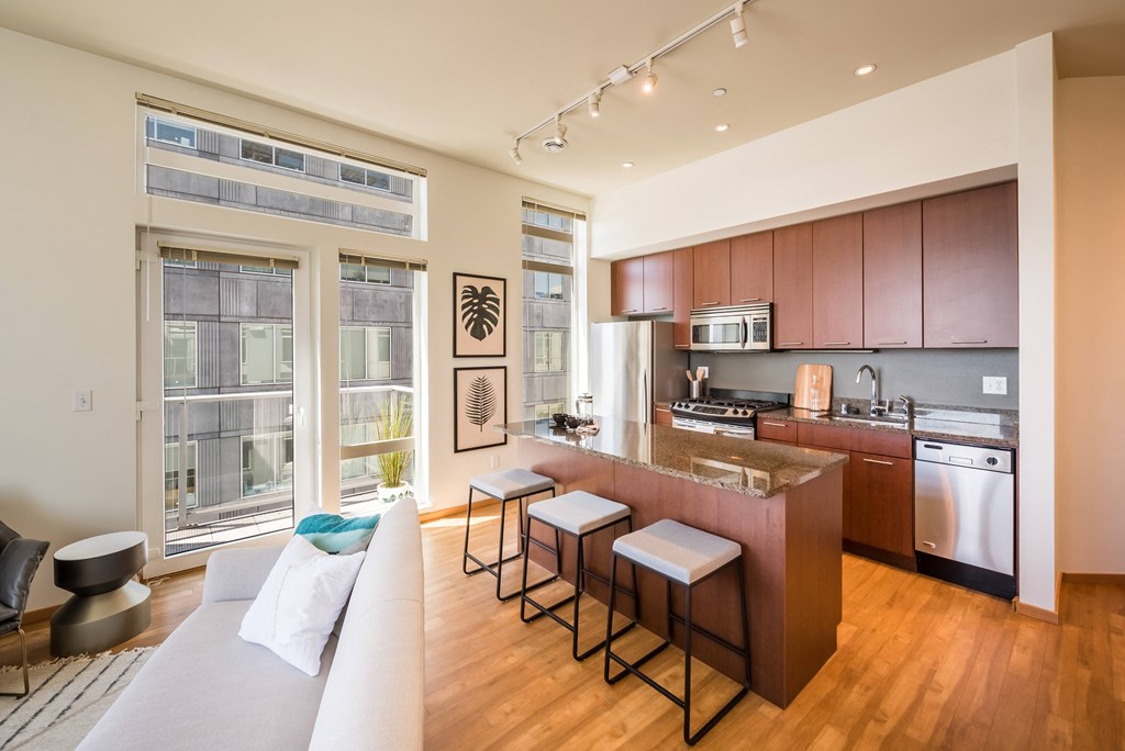 a kitchen and living room in an apartment