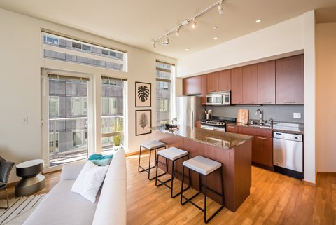 a kitchen and living room in an apartment
