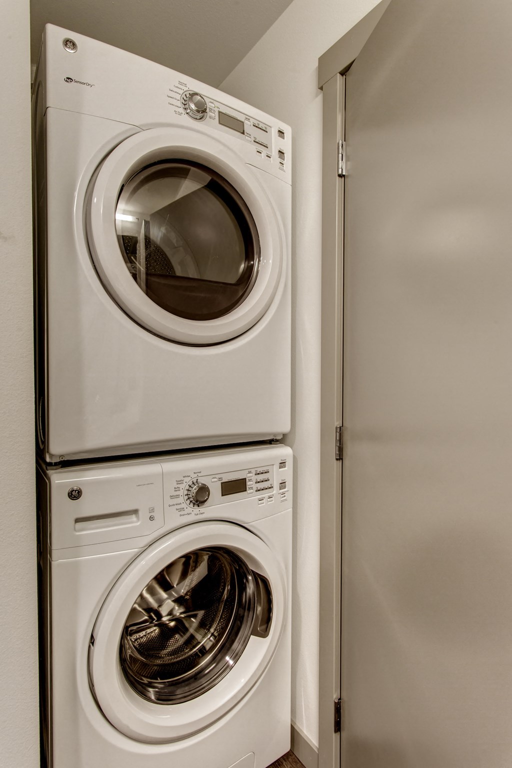 a front loading washer and dryer in a home laundry room
