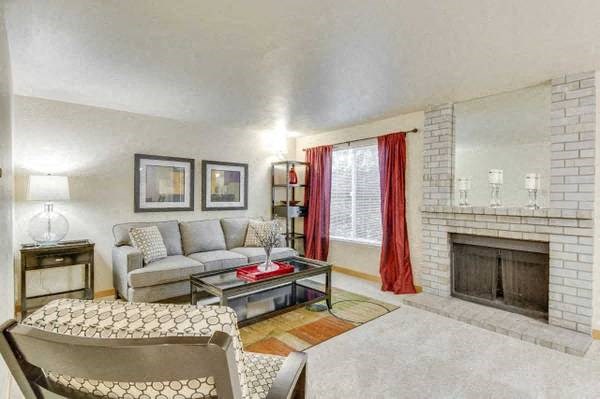 a living room with a couch and a fireplace