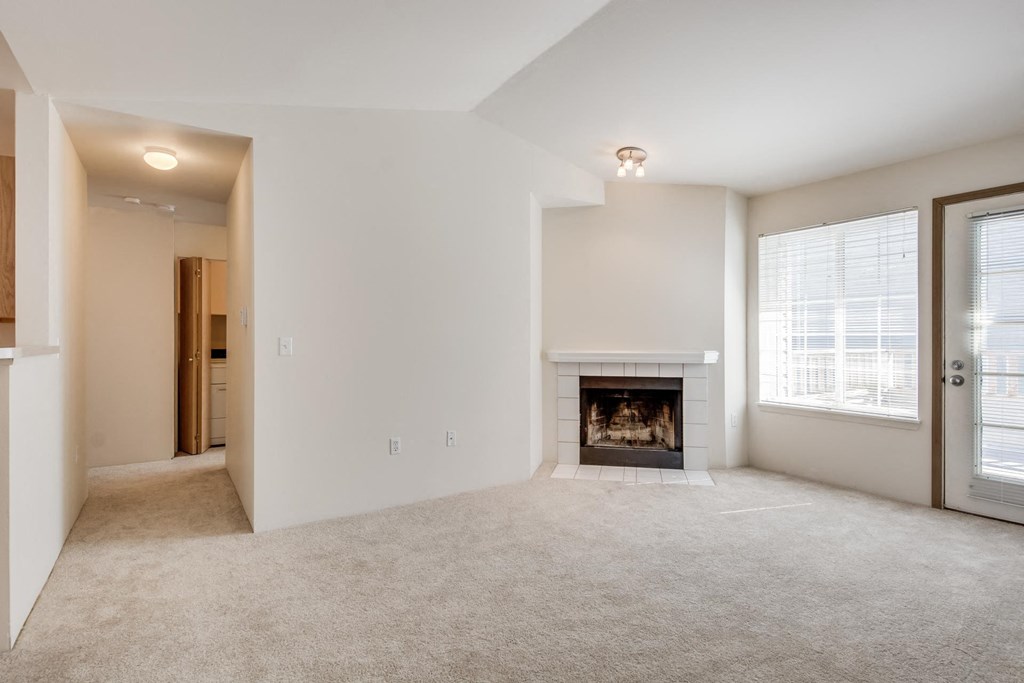 the living room of a home with a fireplace