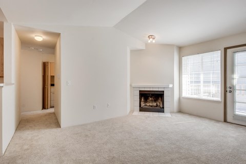 the living room of a home with a fireplace