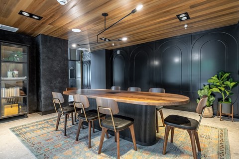 a conference room with a large table and chairs