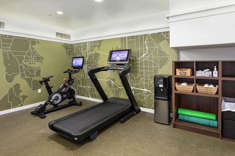 the gym at the inns has a treadmill and a tv