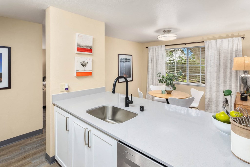 a kitchen with a large counter top and a sink