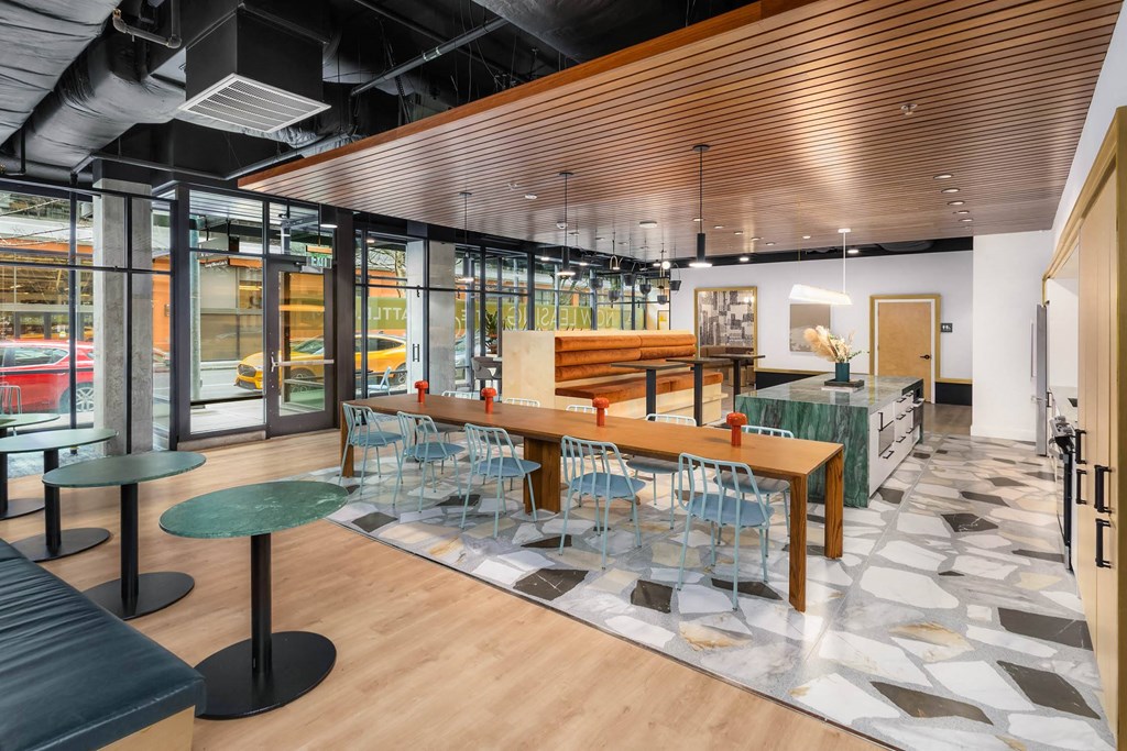 a dining room with a wooden table and chairs