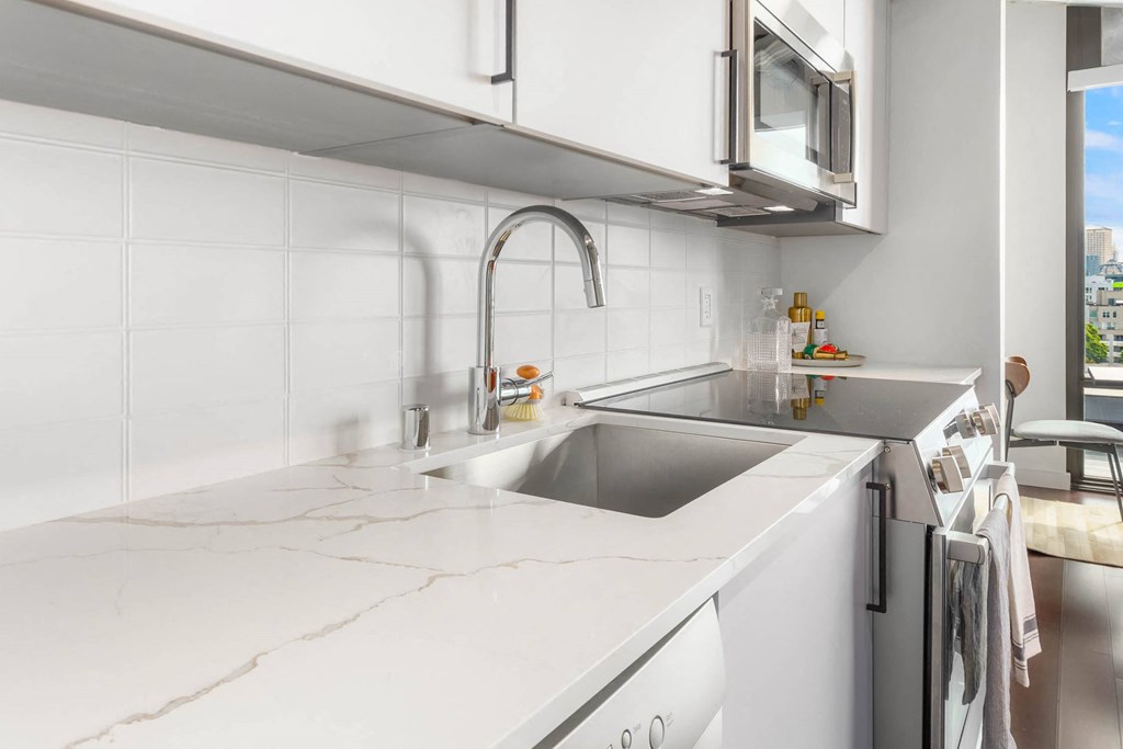 a kitchen with a sink and a window