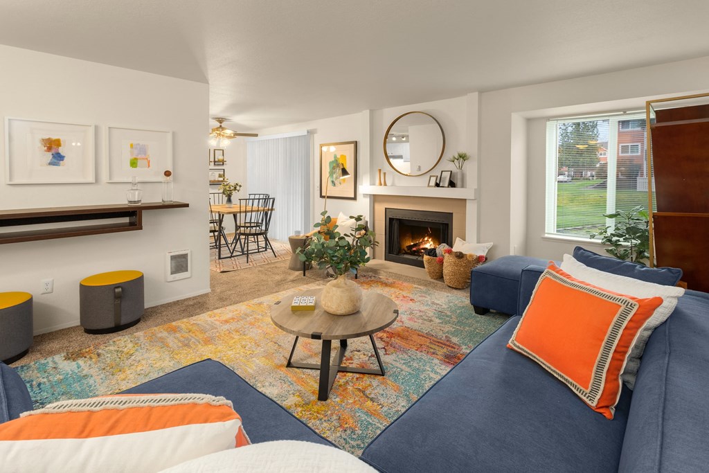 a living room with couches and a fireplace