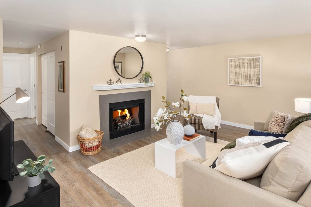 a living room with a fireplace and a couch