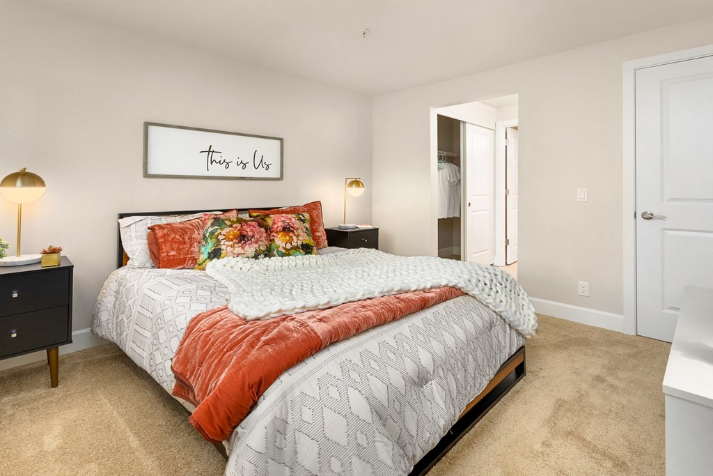 a bedroom with a bed and a closet