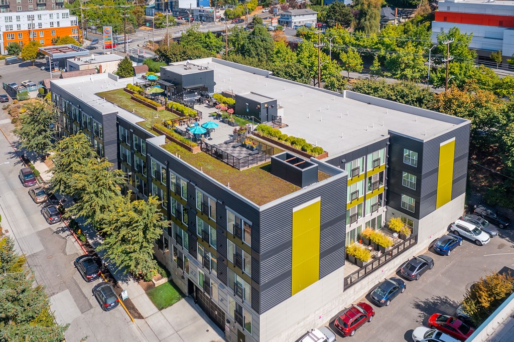 an aerial view of a building with a green roof