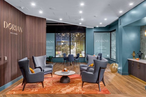 a lobby with chairs and a table