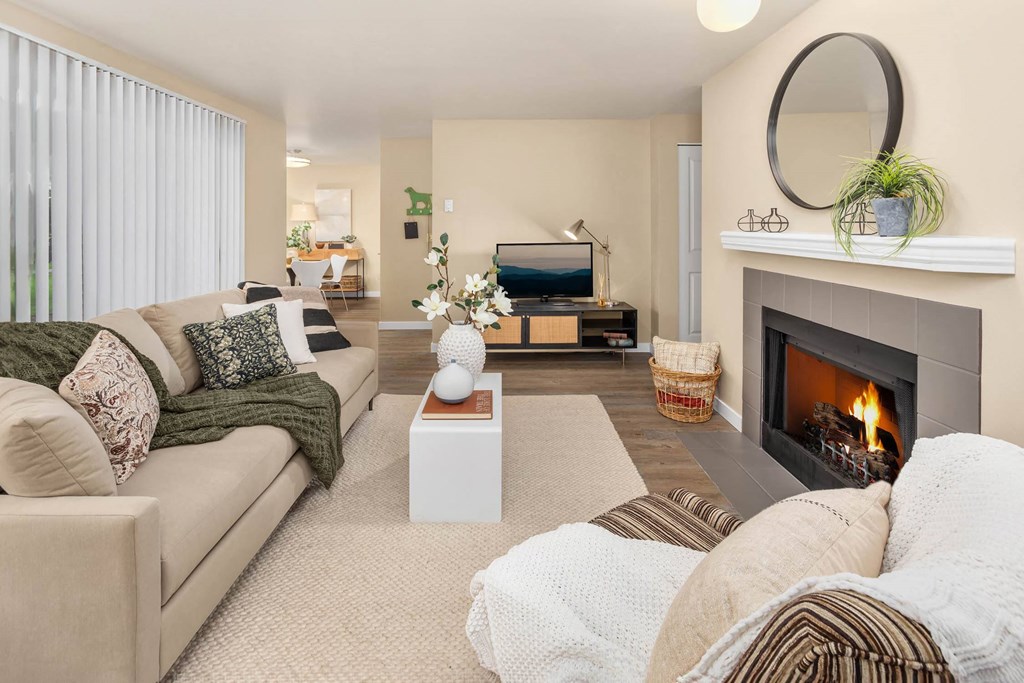 a living room with a fireplace and a couch