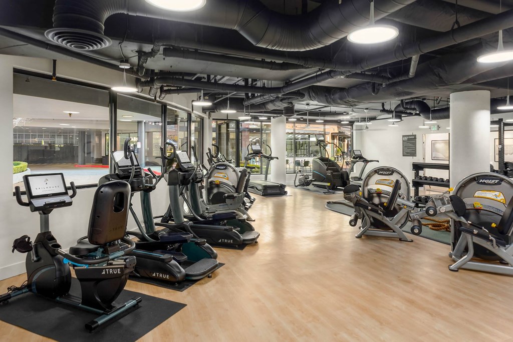 a room filled with lots of different types of exercise equipment