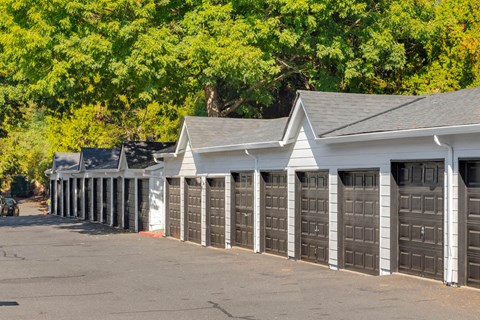 a row of garage doors in a parking lot
