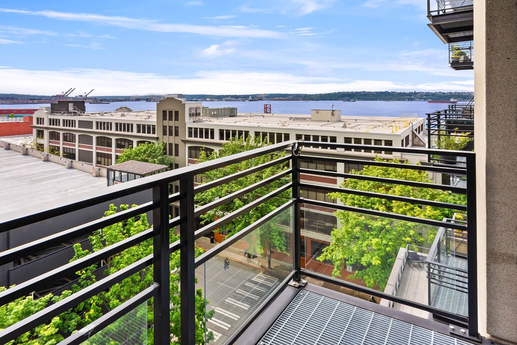 a balcony with a view of a city and a river