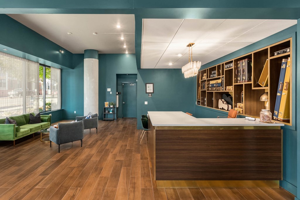 a lobby with a reception desk and chairs
