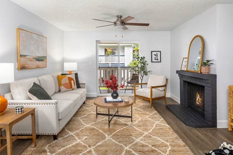 a living room with a couch and a fireplace