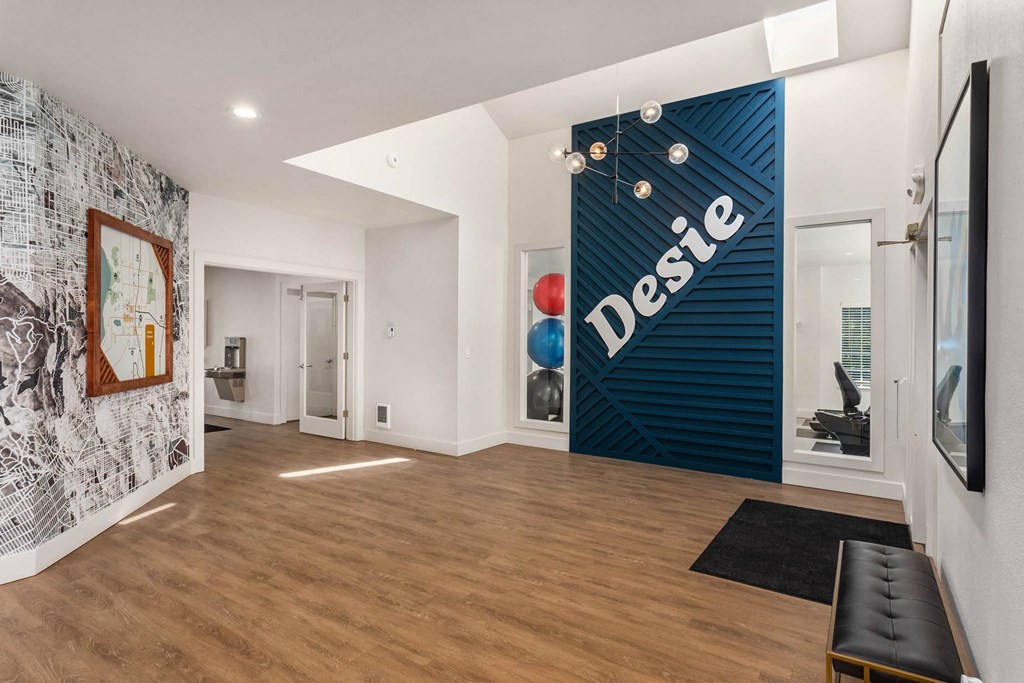 the living room of a house with a blue wall and a door