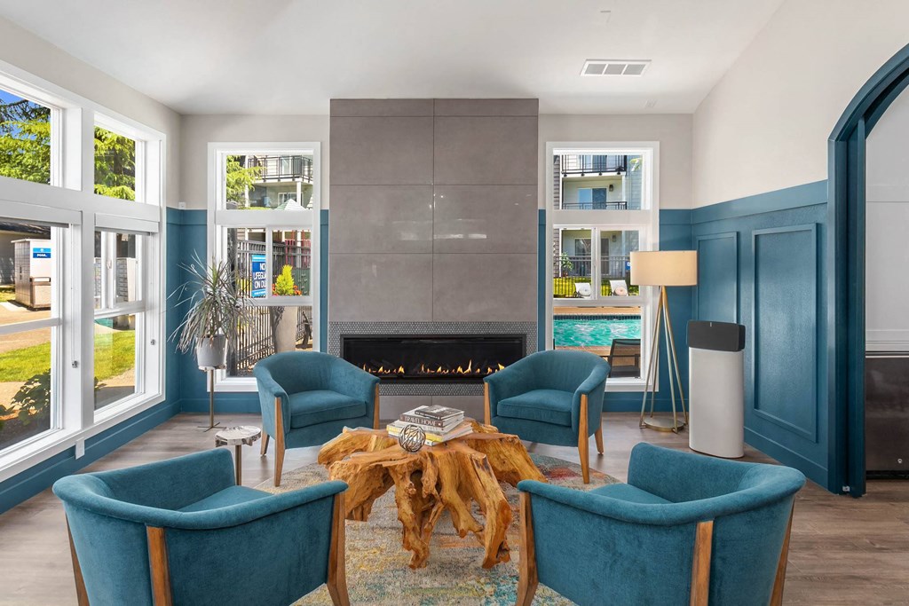 a living room filled with furniture and a fire place