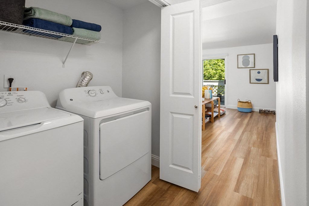 a laundry room with two washes and a dryer in it