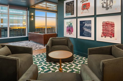 a living room with couches and a coffee table     and pictures